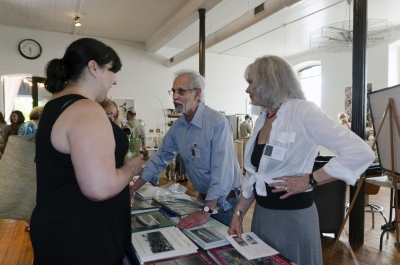 University of the Arts Photography Program head Anne Massoni chats with Michael A. Smith and Paula Chamlee who were presenting their work and books by their imprint, Lodima Press. Photo: Stephen Perloff.