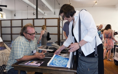 Jennifer Paget looks at work by Dave Moser. Photo: Stephen Perloff.