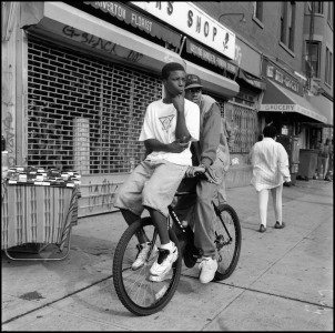 Gerald Cyrus: Two Young Men on Bike, Harlem, 1993