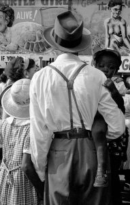 Harold Feinstein: Man with Daughters at Sideshow, Coney Island