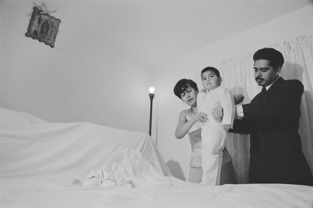 Irma Bohórquez-Geisler: Eduardo Reyes Being Dressed for His Baptism by His Parents, 2005